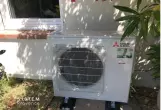 groupe extérieur Mitsubishi Electric  avec unité console dans le salon